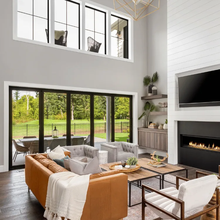 Great room opening to the backyard through a wide wall of glass